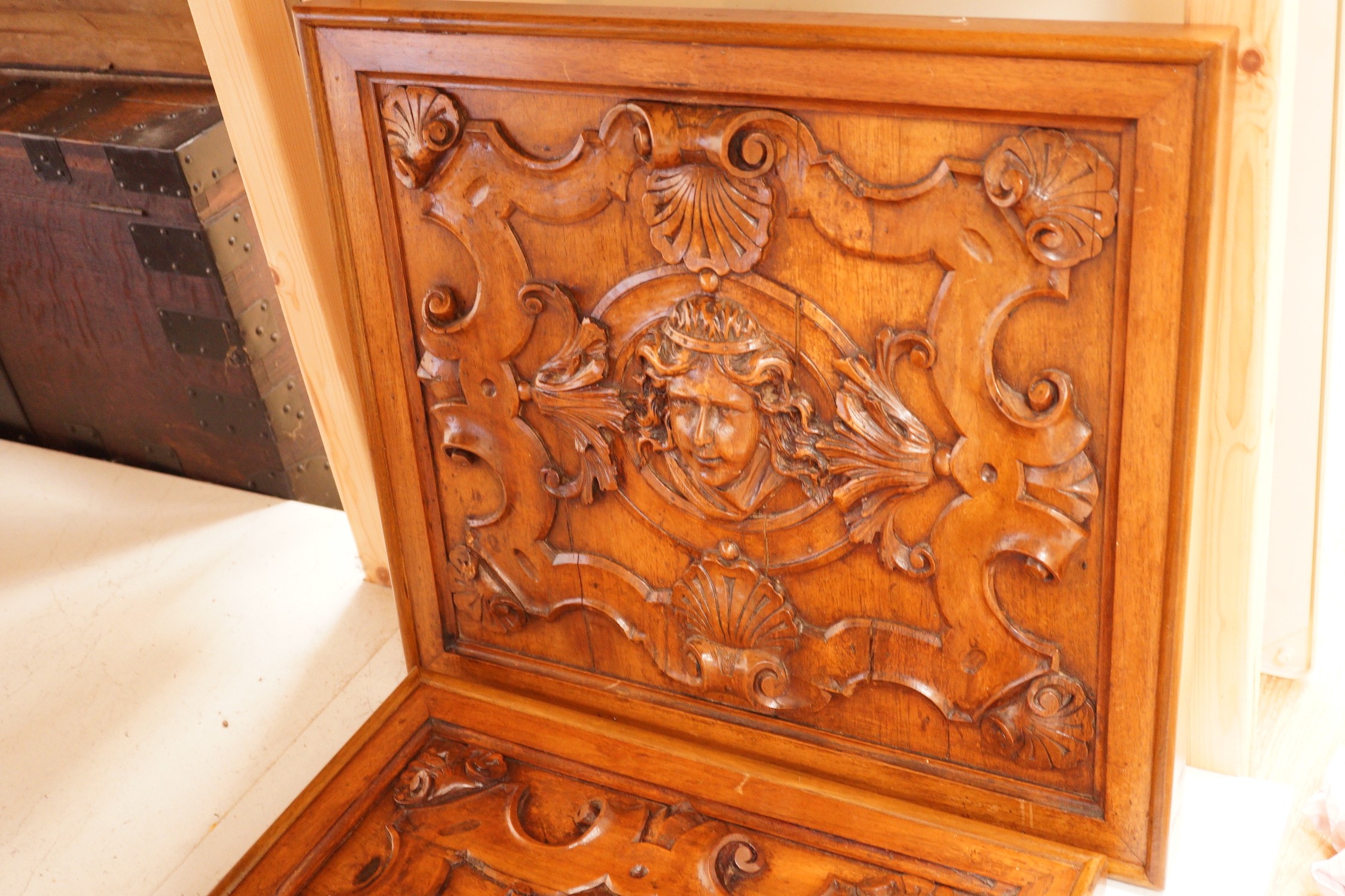 A pair of Mannerist style carved walnut panels, 47x52cm